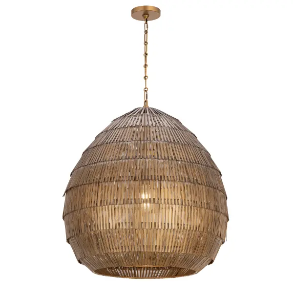 Celebrating artisanal craftsmanship, the Gilda collection offers an elevated, textural presence effortlessly. Strands of hand-strung metal in an Antique Brass finish cascade in concentric layers, adding depth and tonal richness. Suspended from a coordinating decorative chain, the pendant casts a warm, ambient glow that filters through the intricate latticework. With its moody shimmer, the pendants add bold depth and atmosphere to interior spaces. Available in multiple sizes to suit entryways, dining rooms, and beyond.
