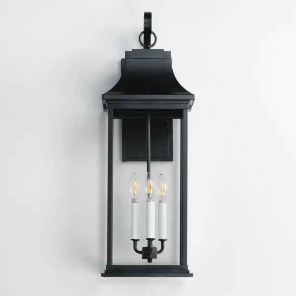 Inspired by classic coach gas lanterns, the Vicksburg collection features die-cast aluminum construction finished in Black with Clear glass. The candle sleeves are done in a contrasting off-white finish to add dimension to the lantern. Available in numerous sizes and configurations including a handsome pocket wall. - alternate view