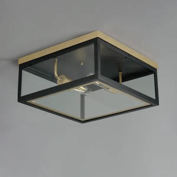 Two-tone frames of Black or White with internal Gold frames provides a neoclassical approach to the squared coach lantern. The sconces jut out from the wall on well-defined trusses that add a contemporary element. Delivering a classic design that suits most exteriors, this collection adds interest in the interior contrasting frame of Gold that secures clear glass panes to diffuse the lamp within. - alternate view