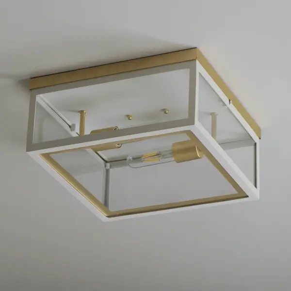 Two-tone frames of Black or White with internal Gold frames provides a neoclassical approach to the squared coach lantern. The sconces jut out from the wall on well-defined trusses that add a contemporary element. Delivering a classic design that suits most exteriors, this collection adds interest in the interior contrasting frame of Gold that secures clear glass panes to diffuse the lamp within. - alternate view