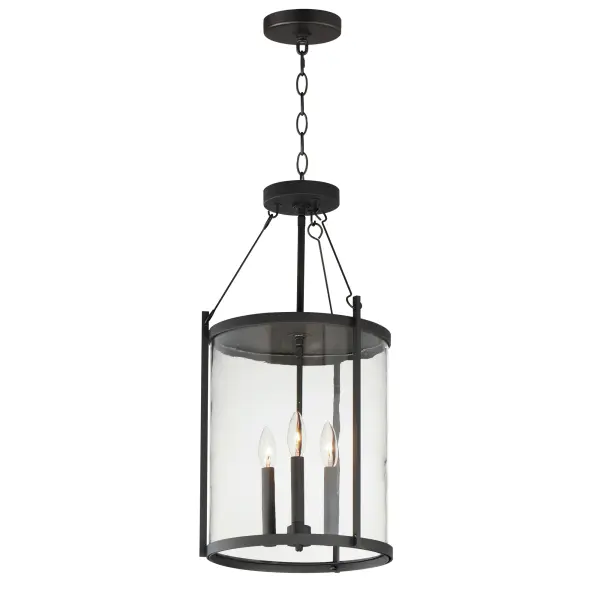 Squared columns in Matte Black finish tower above the cylindrical glass shade rated for outdoor applications. Available in a more modern clear glass option or hammered glass. A rectangular hook detail carries the square form through to the backplate. A modern interpretation of a bell tower, these outdoor pendants and sconces are a cleaned up, transitional look for exteriors.