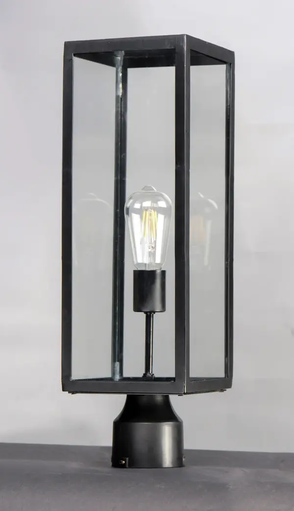 An elongated rectangular shaped design that is both minimalist and industrial. Die cast frames of Dark Bronze support Clear glass panels that provide an unobstructed view of the lantern's interior. Customize with your choice of lamps from vintage to tubular. - alternate view