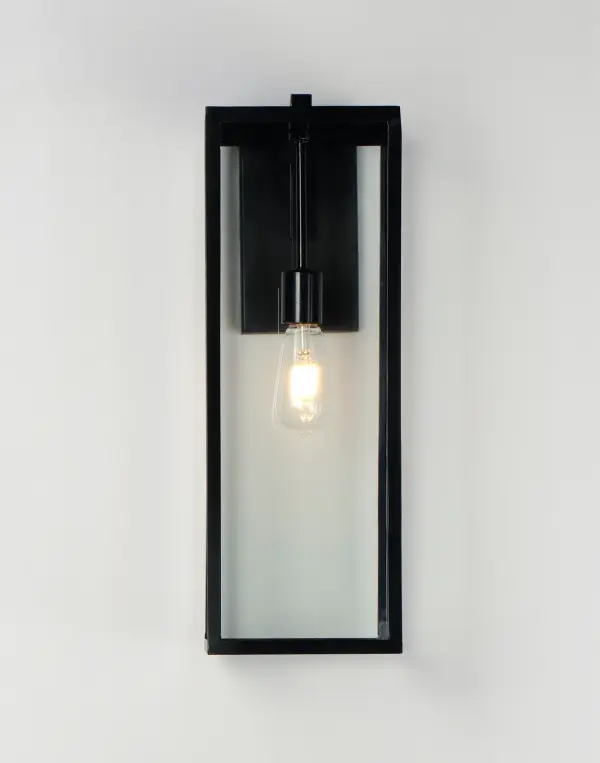 An elongated rectangular shaped design that is both minimalist and industrial. Die cast frames of Dark Bronze support Clear glass panels that provide an unobstructed view of the lantern's interior. Customize with your choice of lamps from vintage to tubular. - alternate view