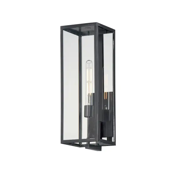 An elongated rectangular shaped design that is both minimalist and industrial. Die cast frames of Dark Bronze support Clear glass panels that provide an unobstructed view of the lantern's interior. Customize with your choice of lamps from vintage to tubular.