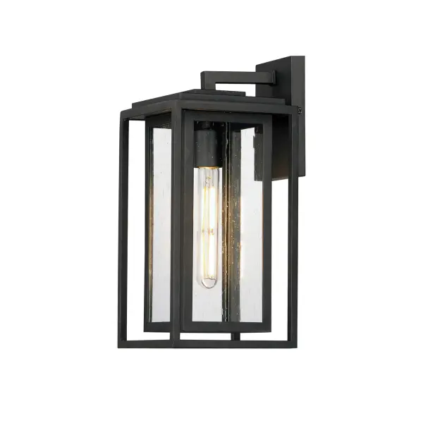 A dual framed structure creates dimension on these outdoor lighting fixtures that is both contemporary and transitional. The construction consists of two frames of square tubing and squared components. The inner frame's Clear Seedy glass reduces glare from the light and appears dirt-free for longer periods. This is a comprehensive collection to brighten all areas of your outdoor space, available in various sized sconces as well as hanging and post configurations.