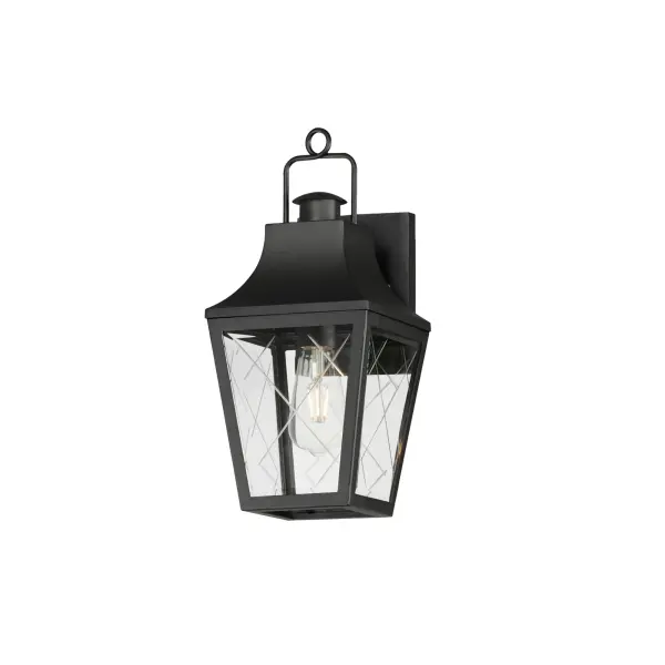 These charming cottage style lanterns feature unique cross-etched glass panels that are Clear and beveled along their edges. Additional design details such as whimsical loops above a chimney element add to the product's delightful appearance. Finished in a Matte Black outdoor rated powder coat, this collection recaptures the appeal of storybook lanterns.