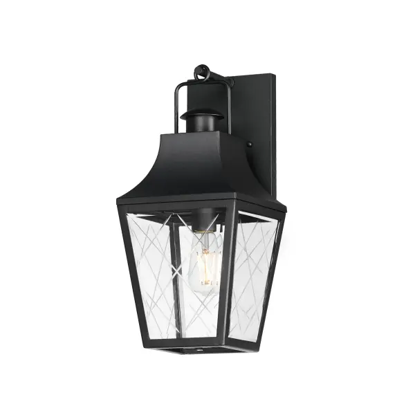 These charming cottage style lanterns feature unique cross-etched glass panels that are Clear and beveled along their edges. Additional design details such as whimsical loops above a chimney element add to the product's delightful appearance. Finished in a Matte Black outdoor rated powder coat, this collection recaptures the appeal of storybook lanterns.