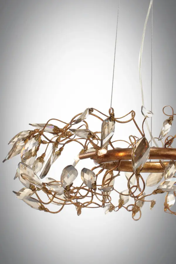 Hand formed wire stems finished in a rich Gold Leaf support delicate petals of Cognac crystal that create a beautiful garden of light. Petite G4 xenon lamps add brilliance and life to the sculpture. - alternate view