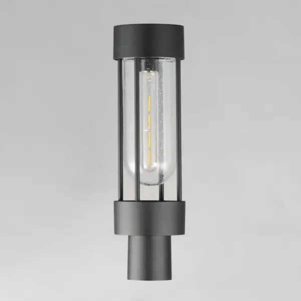 Clean and contemporary, this series of wet location rated outdoor sconces features a capsule of Clear Seeded glass encased within a cage of matte Black outdoor rated powder coat. The transitional appeal of the design pairs well in applications both modern and traditional. Complete the look with a tubular filament lamp. - alternate view