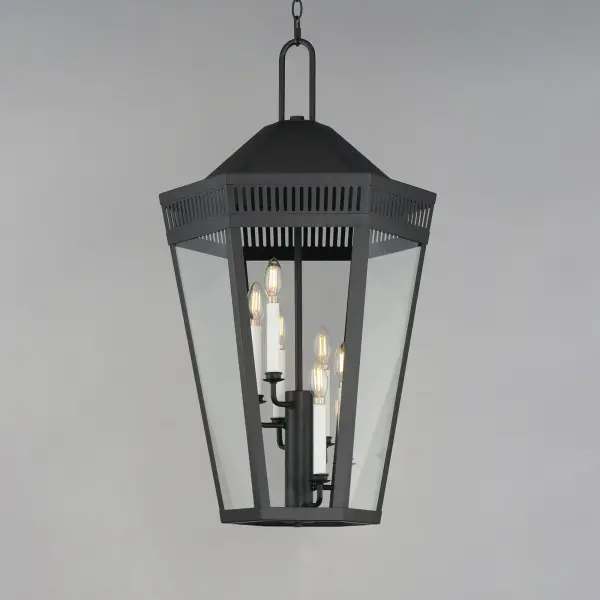 Stately lanterns with perforated filigree along the hood casts a beautiful lighting effect. Finished in Matte Black, the collection is available in multiple sizes as well as flush mount, deck lantern, and two sizes of pendants. - alternate view