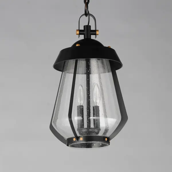 A nod to the nautical, the Marin outdoor sconces feature a two-tone frame of Black with Antique Brass details. Within the frame a pear shaped Clear Seeded glass shields a medium base lamp from the elements. Available in three sizes of sconce, two pendant configurations, and a post mount the collection is a full range of offering of a distinctive, designer look. - alternate view