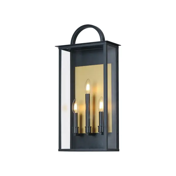 The Manchester series is inspired by classic coach lanterns and consists of minimally extended sconces in a variety of sizes that have been modified with simplified embellishments. The black frames have been modified with a squared arc handle and a contrasting Burnished Gold plate that reflects clusters of candle lights surrounded by Clear glass panels. This collection references historic exterior sconces while modernizing their appearance. Complement the design with tubular lamps to accentuate the verticality of the frames.