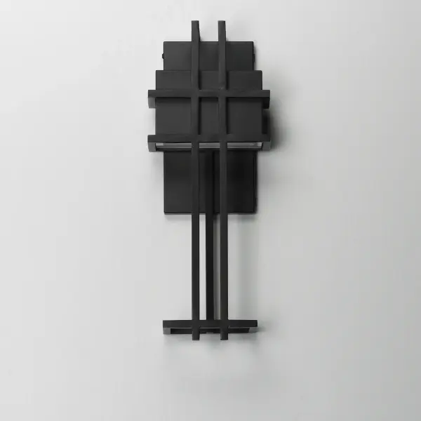 A modern interpretation of the arts & crafts movement, this anti-corrosive aluminum frame combines traditional elements with the latest technology. A concealed LED downlight, housed at the top of the frame, casts a striking pattern of light along the wall, adding depth and warmth to any space. Finished in Matte Black, this fixture seamlessly blends timeless design with modern innovation. - alternate view
