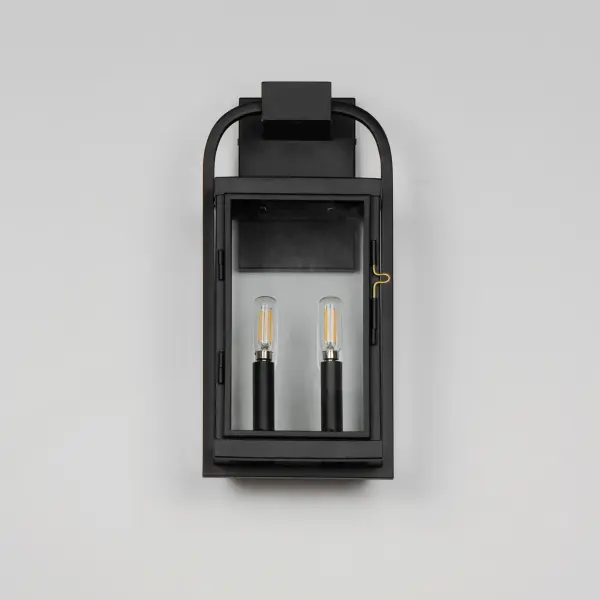 Inspired by classic English lantern design, this collection of outdoor sconces have been streamlined for modern appeal. A convenient, and quaint front door latch allows you to clean and maintain the fixture. Finished in a clean, Matte Black finish with brass hardware and Clear glass panels, two sets of candle sleeves are provided to choose from matching black sleeves or contrasting off-white for a more transitional outlook. - alternate view