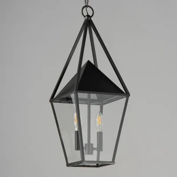 An exaggerated openwork framed steeple adds vertical qualities on a sharp-lined Matte Black lantern frame. Blending modern concepts with forms that evoke a whimsical imagery, this collection presents a transitional styling for outdoor spaces. - alternate view
