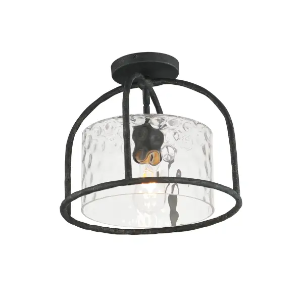 Inspired by classic European lanterns and handcrafted ironwork, the Del Mar collection brings timeless sophistication to exterior spaces. Its airy open-frame silhouette is crafted of hammered iron, elegantly arched with a graceful hook detail that nods to historic gas lamps. Inside the frame, a delicate Water glass cylinder shimmers with texture, diffusing light in a soft, atmospheric glow. Designed for lasting beauty in the elements, each piece is finished in a richly layered Blacksmith finish--a deep near-black tone highlighted by silvery brushstrokes, adding artisanal character to the silhouette. Whether flanking a grand entry or lining a garden path, Del Mar offers a refined approach to outdoor lighting with enduring presence.
