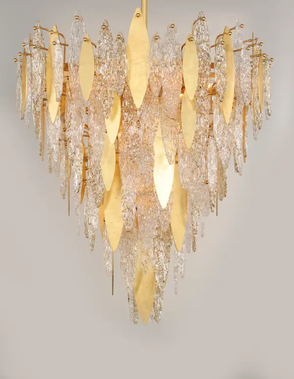 Hand-formed glass petals of Clear and Champagne-tint suspend from a tiered frame of gold and accented with petals of solid metal finished in Gold Leaf. Numerous candelabra sockets are strategically placed within the fixture to create glimmer and elegance to this majestic collection. - alternate view
