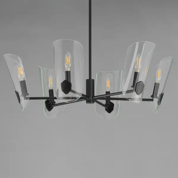 A Coat of Arms in curved Clear glass shades bevel cut and shaped to resemble traditional shields radiates off slender tubular arms. The streamlined design takes on a transitional approach with imaginative details that carries through to the concept for the wall sconce. Available 2 sizes of chandelier and a single light wall sconce in either Matte Black or Natural Aged Brass. - alternate view