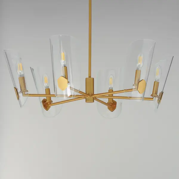 The Armory chandelier brings distinctive character with its beveled clear glass shades shaped like traditional shields. The streamlined tubular arms in Natural Aged Brass create a refined transitional aesthetic that works across design styles. - alternate view