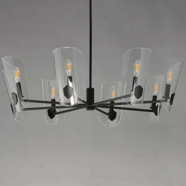 A Coat of Arms in curved Clear glass shades bevel cut and shaped to resemble traditional shields radiates off slender tubular arms. The streamlined design takes on a transitional approach with imaginative details that carries through to the concept for the wall sconce. Available 2 sizes of chandelier and a single light wall sconce in either Matte Black or Natural Aged Brass. - alternate view