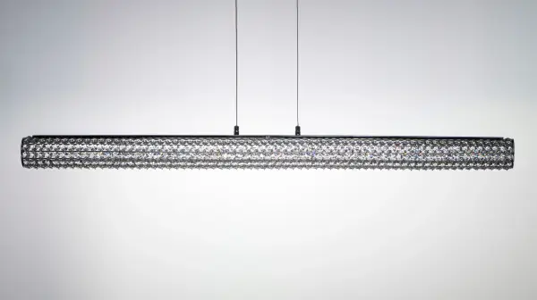 Clear Beveled Crystals are strung onto a continuous wire and wrapped over a tubular metal frame finished in your choice of a high luster Polished Chrome or vibrant Rose Gold. Hidden within the tubular frame is a LED light source, which not only adds beauty and sparkle to the crystal, but adds ample light for the vanity. - alternate view