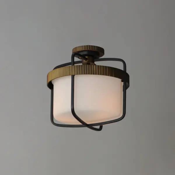 Featuring ridged collars of Antique Brass on a matte Black frame, the design of this series of chandeliers, pendants, semi-flush mounts and sconce lighting offers a transitional and stately companion to fixtures in coordinating finishes. The lighting is diffused through a rounded cylinder of Satin White glass that softly spreads illumination. - alternate view