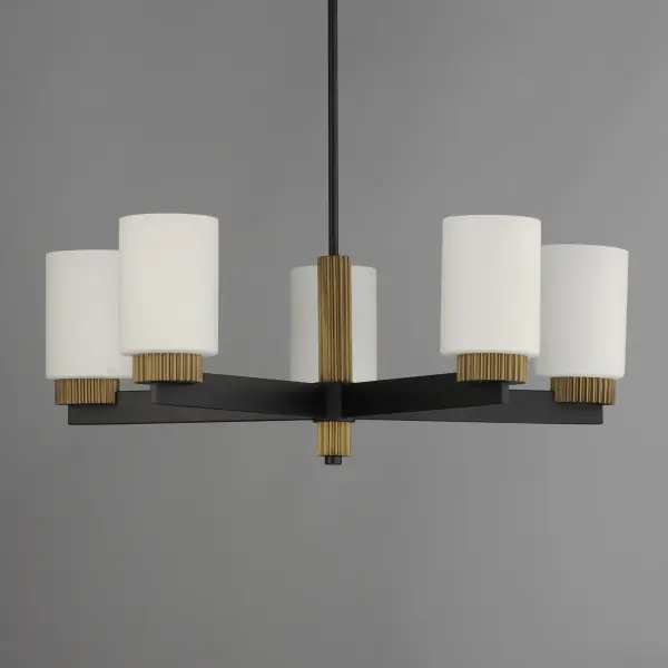 Featuring ridged collars of Antique Brass on a matte Black frame, the design of this series of chandeliers, pendants, semi-flush mounts and sconce lighting offers a transitional and stately companion to fixtures in coordinating finishes. The lighting is diffused through a rounded cylinder of Satin White glass that softly spreads illumination. - alternate view