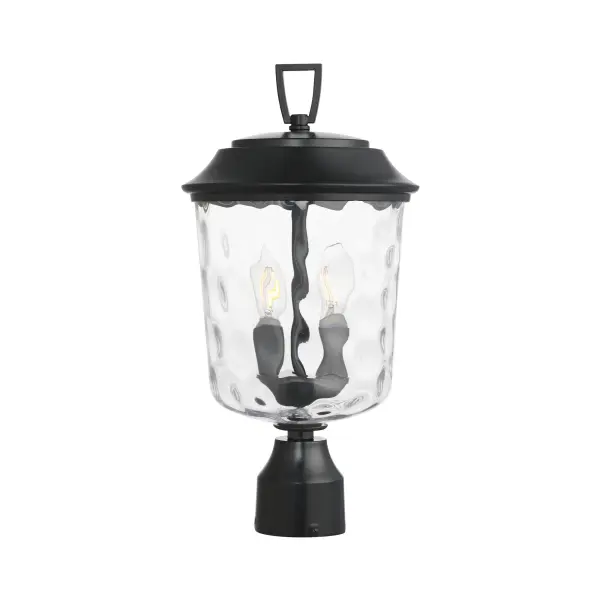 The Prescott collection of outdoor lanterns reimagines a classic design with timeless elegance. Crafted with a durable die-cast aluminum frame and finished in a sleek Matte Black, these lanterns exude a refined, understated charm. The water glass shade creates a beautiful lighting effect as it casts dazzling patterns on its surrounding surfaces. Thoughtfully updated with simple stirrup hook details, the collection effortlessly blends tradition with modern sophistication.