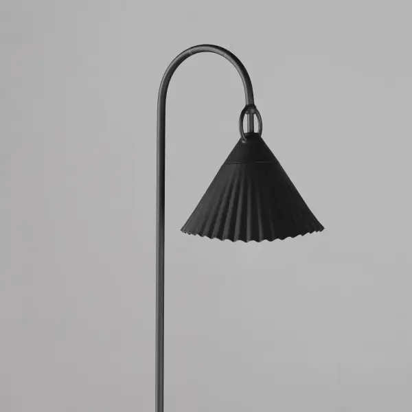 Adding charm to the outdoors, the Odette series features a scalloped pyramid shade suspended from a ring of Die Cast Aluminum. Supported within the shade is an inverse pyramid that peaks out beneath the hem of the aluminum shade marrying the two pyramid forms. Graceful and playful, these outdoor sconces add the designer touch to both indoor and outdoor locations. - alternate view