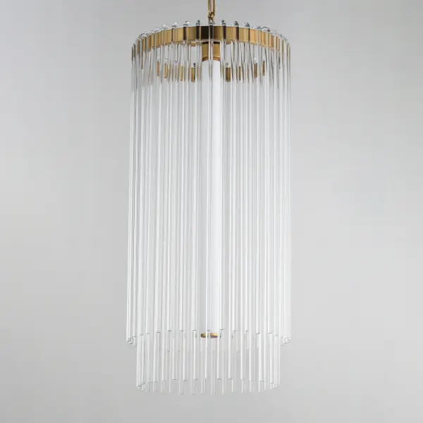 Clear glass rods elegantly curve to drape over a metal frame, encasing an integrated LED light source within. These ornamental glass rods form a luminous curtain, softly illuminated by the LEDs. The LED light source features an adjustable color temperature, allowing you to effortlessly switch between warm 2700K, neutral 3200K, and cool 4000K settings to suit any ambiance. Suspended by intricately designed chain links, the jewel-like glass skirt adds a touch of sophistication and refinement. Choose from two stunning frame finishes: Natural Aged Brass or Polished Nickel. - alternate view