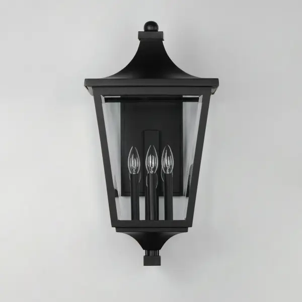 Stately outdoor sconces reference classic lantern shapes and are constructed of Maxim's proprietary Vivex composite, a robust weather-resistant materials guaranteed to withstand harsh weather climates. Available in several sizes and illuminated with clusters of candle sockets, this is a timeless design built to last. - alternate view