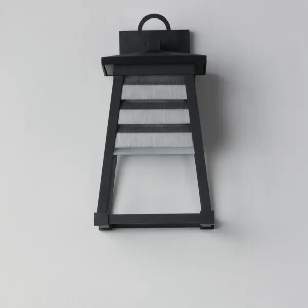 Contrasting louvered insets are set within Matte Black trapezoidal frames. The frames are made of Vivex so their finish will withstand harsher climates. The louvered panel insets are made of aluminum and feature a full cut-off design aesthetic making this design suitable for Dark Sky applications. An added benefit is the removal of glass altogether, adding a robust quality to the construction of the fixtures leading to longevity and lower maintenance. These wide plank louver panels complement the design's coastal styling adding interest in contrasting Weathered Zinc or White options, while the matte Black finish blends into the frame for a cleaner, more seamless approach. - alternate view
