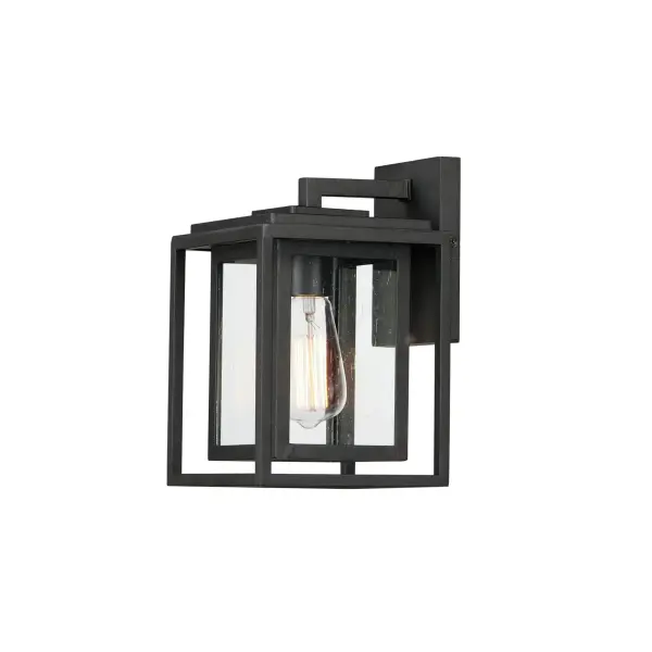 A dual framed structure creates dimension on these outdoor lighting fixtures that is both contemporary and transitional. The construction consists of two frames of square tubing and squared components. The inner frame's Clear Seedy glass reduces glare from the light and appears dirt-free for longer periods. This is a comprehensive collection to brighten all areas of your outdoor space, available in various sized sconces as well as hanging and post configurations.