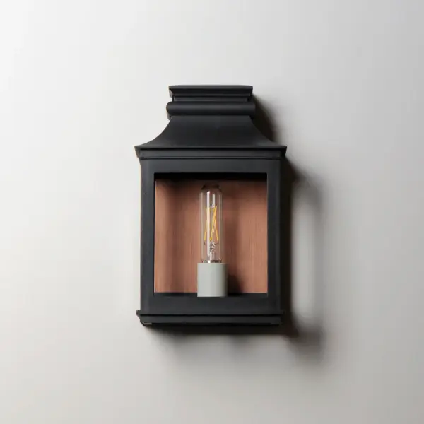 Inspired by classic colonial design, these climate-tough pocket sconces offer traditional charm and stylish finish combinations. Clear glass allows unobstructed light output and visibility into the sconces with candlesticks that stand out in their off-white finish. While the outer frame is made in a textured Black Oxide finish, the interior plate is finished either in a matching finish or contrasting Antique Copper or Verdigris finish. Available as a one, two, or three-light wall sconce, this offering of pocket sconces presents another style of Vivex outdoor products complementing more traditional exteriors. - alternate view