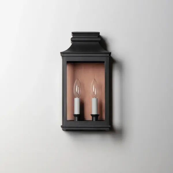 Inspired by classic colonial design, these climate-tough pocket sconces offer traditional charm and stylish finish combinations. Clear glass allows unobstructed light output and visibility into the sconces with candlesticks that stand out in their off-white finish. While the outer frame is made in a textured Black Oxide finish, the interior plate is finished either in a matching finish or contrasting Antique Copper or Verdigris finish. Available as a one, two, or three-light wall sconce, this offering of pocket sconces presents another style of Vivex outdoor products complementing more traditional exteriors. - alternate view