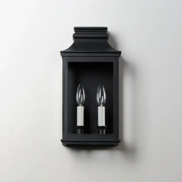 Inspired by classic colonial design, these climate-tough pocket sconces offer traditional charm and stylish finish combinations. Clear glass allows unobstructed light output and visibility into the sconces with candlesticks that stand out in their off-white finish. While the outer frame is made in a textured Black Oxide finish, the interior plate is finished either in a matching finish or contrasting Antique Copper or Verdigris finish. Available as a one, two, or three-light wall sconce, this offering of pocket sconces presents another style of Vivex outdoor products complementing more traditional exteriors. - alternate view