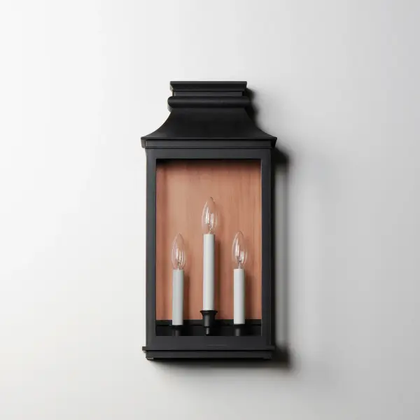 Inspired by classic colonial design, these climate-tough pocket sconces offer traditional charm and stylish finish combinations. Clear glass allows unobstructed light output and visibility into the sconces with candlesticks that stand out in their off-white finish. While the outer frame is made in a textured Black Oxide finish, the interior plate is finished either in a matching finish or contrasting Antique Copper or Verdigris finish. Available as a one, two, or three-light wall sconce, this offering of pocket sconces presents another style of Vivex outdoor products complementing more traditional exteriors. - alternate view