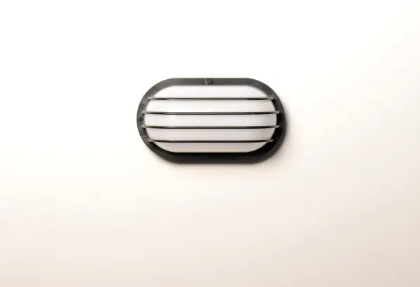 Classic bulkhead style fixtures made of high impact polycarbonate. Unlike the die cast counterparts these fixtures are non-corrosive so works perfect in coastal areas. Available in both integrated LED and E26 socket configurations, these make for a low maintenance and cost effective alternative. - alternate view