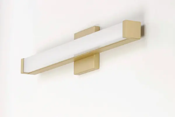 This minimalistic contemporary approach to LED vanity lighting will be the standard for both residential and commercial applications. The light engine features a high quality dimmable driver with multi volt input and high color rendering LEDs for the ultimate vanity lighting. Collection: Spec Finish: Gold Width: 18.00" Height: 1.75" Length: 2.25" Weight: 1.71 lb Extension from Wall: 2.25" Wire: 8" Canopy: 4.75"x4.75" Bulbs Included Number of Bulbs: 1 Maximum Wattage: 12.00 W Bulb Type: PCB Bulb Base: PCB Integrated Light Source: LED Light Output: 880.00 lm Color Temperature: 3000 K CRI: 90 Rated Average Life: 50000 Voltage: 120.00 V Material: Aluminum, Acrylic Safety Listing: cETLus Safety Rating: Damp ADA LED Manufacturer Warranty: 5 Spec Sheet Instructions Parts Diagram - alternate view