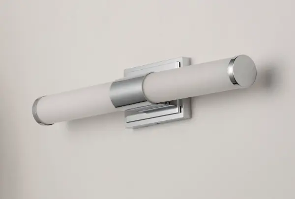 Cylinders of White cased glass are mounted onto a cast aluminum frame of Satin Nickel or Polished Chrome. LED modules evenly illuminate and provide soft yet ample illumination. Multi volt input is standard which allows for installation into commercial applications. - alternate view
