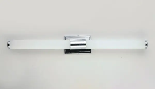 Cylinders of White cased glass are mounted onto a cast aluminum frame of Satin Nickel or Polished Chrome. LED modules evenly illuminate and provide soft yet ample illumination. Multi volt input is standard which allows for installation into commercial applications. - alternate view