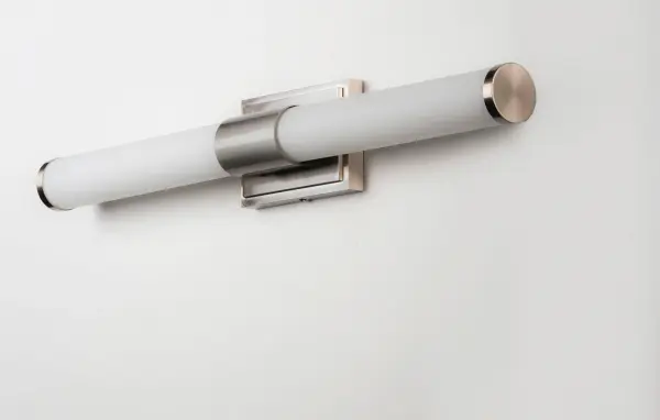 Cylinders of White cased glass are mounted onto a cast aluminum frame of Satin Nickel or Polished Chrome. LED modules evenly illuminate and provide soft yet ample illumination. Multi volt input is standard which allows for installation into commercial applications. Collection: Optic Finish: Satin Nickel Glass: White Width: 30.00" Height: 4.75" Length: 30.00" Weight: 5.03 lb Extension from Wall: 3.50" Wire: 8" Canopy: 4.75"x7" Bulbs Included Number of Bulbs: 1 Maximum Wattage: 20.00 W Bulb Type: PCB Bulb Base: PCB Integrated Light Source: LED Light Output: 1550.00 lm Color Temperature: 3000 K CRI: 90 Rated Average Life: 50000 Voltage: 120.00 V Material: Aluminum, Glass Safety Listing: cETLus Safety Rating: Damp ADA Title 24 LED Manufacturer Warranty: 5 Spec Sheet Instructions Parts Diagram - alternate view