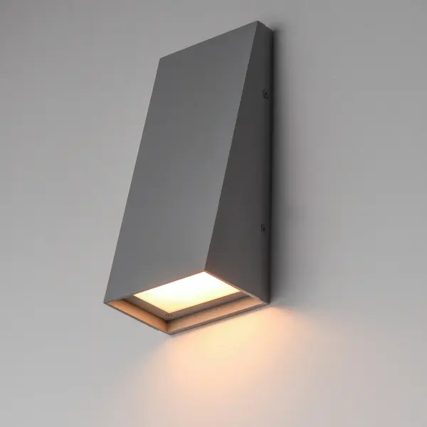 With solid Die-Cast Aluminum construction and powered by a range voltage input driver, Pathfinder is a high performance down light for commercial and residential installations. Choose from a variety of sizes, shapes that are sharply angled or smoothly sloping, and various photocell and motion sensor options. Also available with enabled switch to toggle between 5 light Color Temperature settings, this popular sconce has even more versatility. Choose from Black, Architectural Bronze, or Metallic Sliver outdoor-rated powder coat finishes. Collection: Pathfinder Finish: Silver Width: 5.00" Height: 12.00" Weight: 3.30 lb Extension from Wall: 4.00" Wire: 8" Canopy: 12"x5" Bulbs Included Number of Bulbs: 1 Maximum Wattage: 25.00 W Bulb Type: LED Bulb Base: Integrated Light Source: LED Light Output: 1150.00 lm Color Temperature: 2200 K CRI: 90 Rated Average Life: 25000 Voltage: 120.00 V Material: Aluminum, Glass Safety Listing: cETLus Safety Rating: Wet ADA LED Manufacturer Warranty: 2 Spec Sheet - alternate view