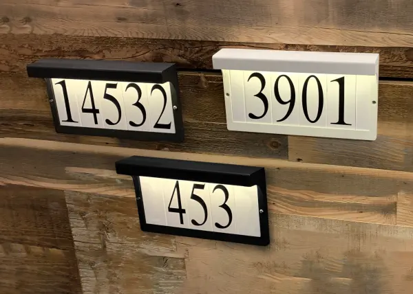For Vertical and Horizontal configurations, look no further than these address lights. Conveniently square tiles are available in Classic and contemporary fonts with your choice of a more decorative or clean frame. Ranging from 12-24V, these address lights pair with both landscape transformers and doorbell chime transformers to allow low voltage wire installations. Available in Bronze and Black. - alternate view