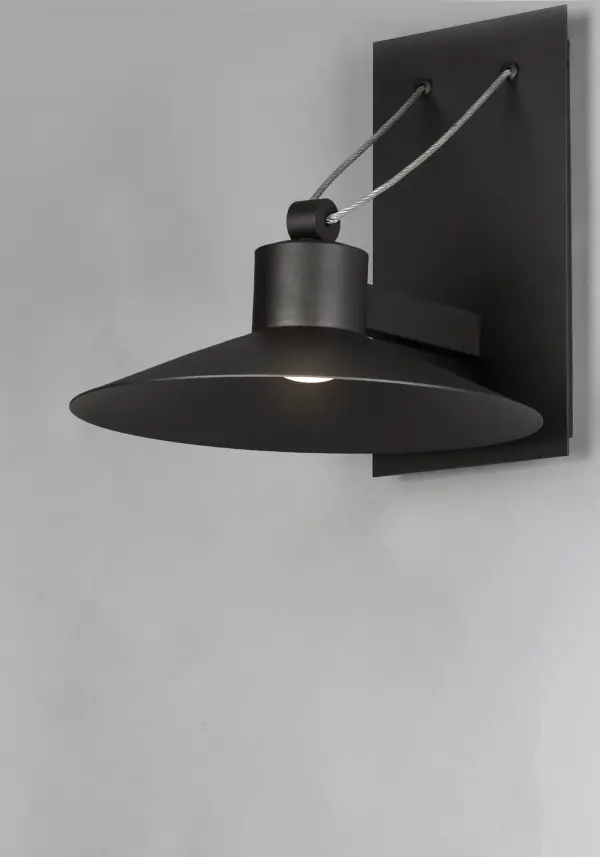 Conical shades finished in Architectural Bronze appear to be suspended by its stainless steel cable. Concealed inside these shades is a high powered COB LED which shines into a heavy Clear glass font. The bottom of theses fonts have an additional thickness of glass for better light distribution and lighting effect. - alternate view