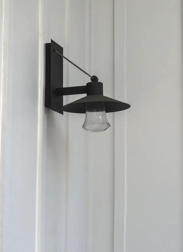 Conical shades finished in Architectural Bronze appear to be suspended by its stainless steel cable. Concealed inside these shades is a high powered COB LED which shines into a heavy Clear glass font. The bottom of theses fonts have an additional thickness of glass for better light distribution and lighting effect. - alternate view