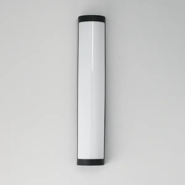 Featuring robust aluminum construction, the Halfpipe collection is designed for commercial applications outdoor. A half round form factor of uniformly illuminated frosted UV-rated acrylic diffuser is framed in Black or Brushed Aluminum metal. Commercially rated, dedicated 120-277V LED components, delivers reliable performance in demanding environments. While ideal for exterior facades, its ADA-compliant extension makes it equally suited for interior spaces such as elevator lobbies, hallways, and meeting rooms. Collection: Halfpipe Finish: Black Glass: White Width: 5.00" Height: 26.00" Weight: 7.89 lb Extension from Wall: 4.00" Wire: 8" Canopy: 4.25"x0.75" Bulbs Included Number of Bulbs: 2 Maximum Wattage: 18.00 W Bulb Base: Integrated Light Source: LED Light Output: 1800.00 lm Color Temperature: 2700 K CRI: 90 Rated Average Life: 35000 Voltage: 120.00 V Material: Satinledd Steel, Acrylic Safety Listing: cETLus Safety Rating: Wet ADA LED Spec Sheet Instructions - alternate view