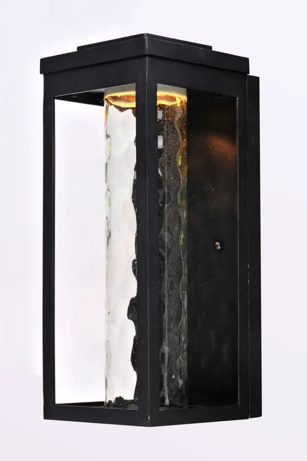 A classic style cast aluminum open frame finished in Black houses a variety of diffusers to create different design element to fit a wide range of home designs. You have your choice of Satin White or Water Glass cylinders and Clear Ribbed or stainless steel Mesh Screen square diffusers. The top housing conceals a high power LED light module with excellent color rendering as well as efficient lumens per watt. All of this at an unbelievable price. Collection: Salon LED Finish: Black Glass: Water Glass Width: 6.00" Height: 15.00" Weight: 5.06 lb Extension from Wall: 6.75" Canopy: 13.75"x5.75" Bulbs Included Number of Bulbs: 1 Maximum Wattage: 12.00 W Bulb Type: AC Bulb Base: Integrated Light Source: LED Light Output: 650.00 lm Color Temperature: 3000 K CRI: 90 Voltage: 120.00 V Material: Aluminum, Glass Safety Listing: cETLus Safety Rating: Wet Dark Sky LED Spec Sheet Instructions Parts Diagram - alternate view