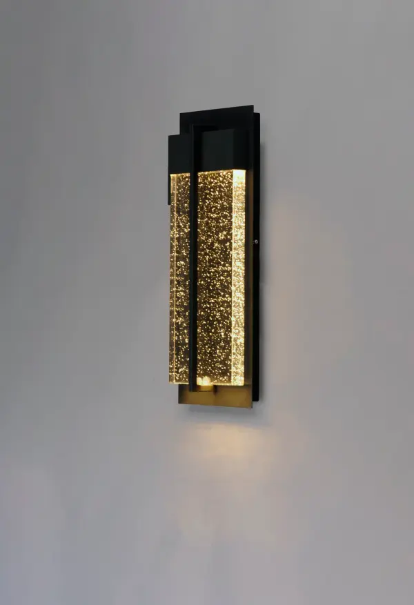This popular outdoor collection gets an improved facelift and has additional sizes for a more complete collection. The Black finish presents a dramatic background for the solid block of Bubble Glass that is brightly illuminated by the LED concealed in the top housing. - alternate view