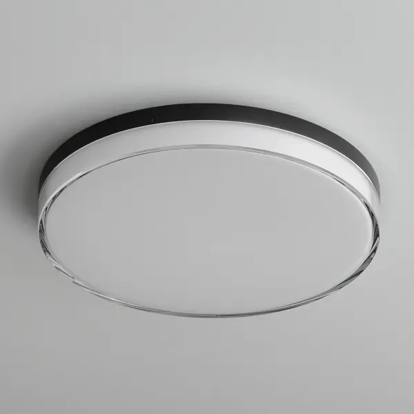 Defined by its contemporary edge, this series of flush mounts and wall sconces features a layered dimensional shade of acrylic. The thick miter cut Clear acrylic encases an inner opal White diffuser that is evenly illuminated by a high-powered integrated LED. Select from 5 different color temperatures using an easily accessible switch on the frame. - alternate view